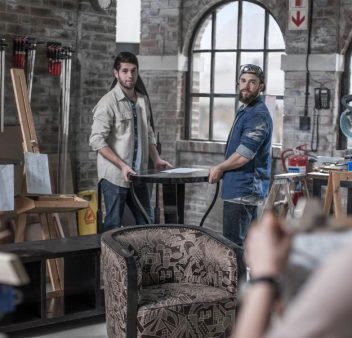 manager-directing-male-workers-carrying-table-in-a-2024-06-17-19-53-46-utc